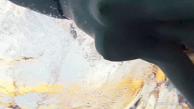 Redheaded Katrin Stripping Underwater