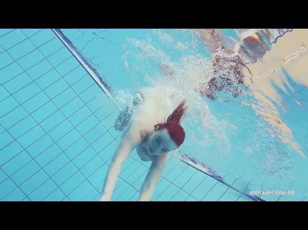 Redheaded Katrin Stripping Underwater