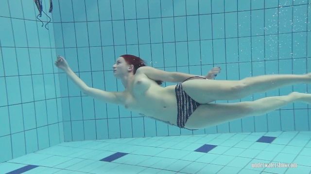 Redheaded Katrin Stripping Underwater